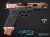 FROM THE WORLD OF JOHN WICK: BALLERINA - PISTOLET EMG TARAN TACTICAL INNOVATIONS GLOCK G17 LICENCE OFFICIELLE LIMITED EDITION TOUT METAL BRONZÉ AVEC RETOUR DE CULASSE (LICENSED TTI / ARMY ARMAMENT)