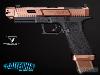 FROM THE WORLD OF JOHN WICK: BALLERINA - PISTOLET EMG TARAN TACTICAL INNOVATIONS GLOCK G17 LICENCE OFFICIELLE LIMITED EDITION TOUT METAL BRONZÉ AVEC RETOUR DE CULASSE (LICENSED TTI / ARMY ARMAMENT)